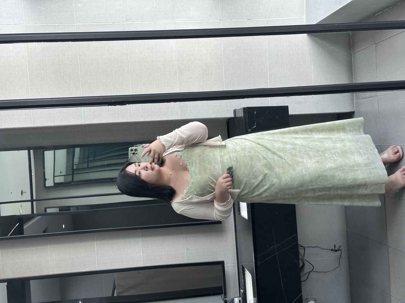 Omalicha in a green dress