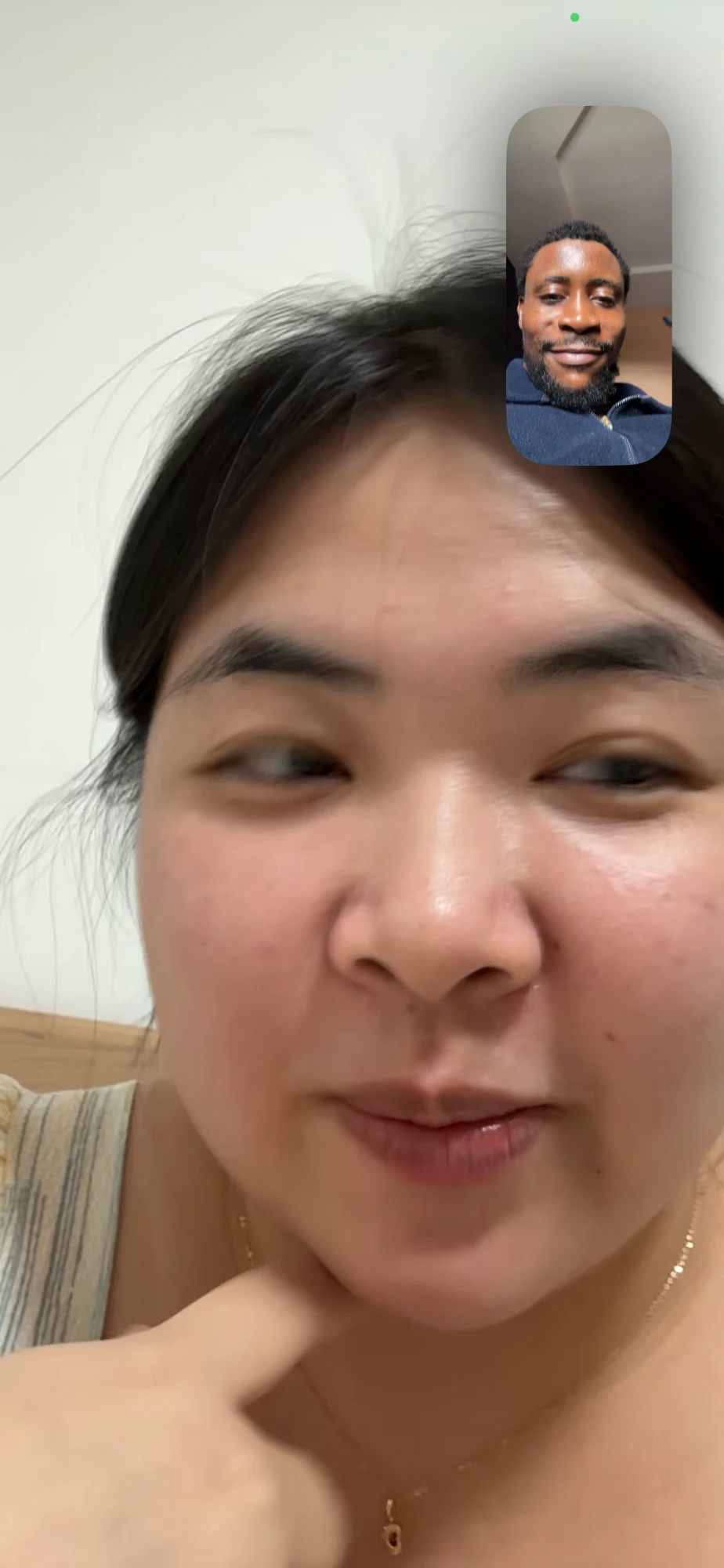 Omalicha smiling on a call
