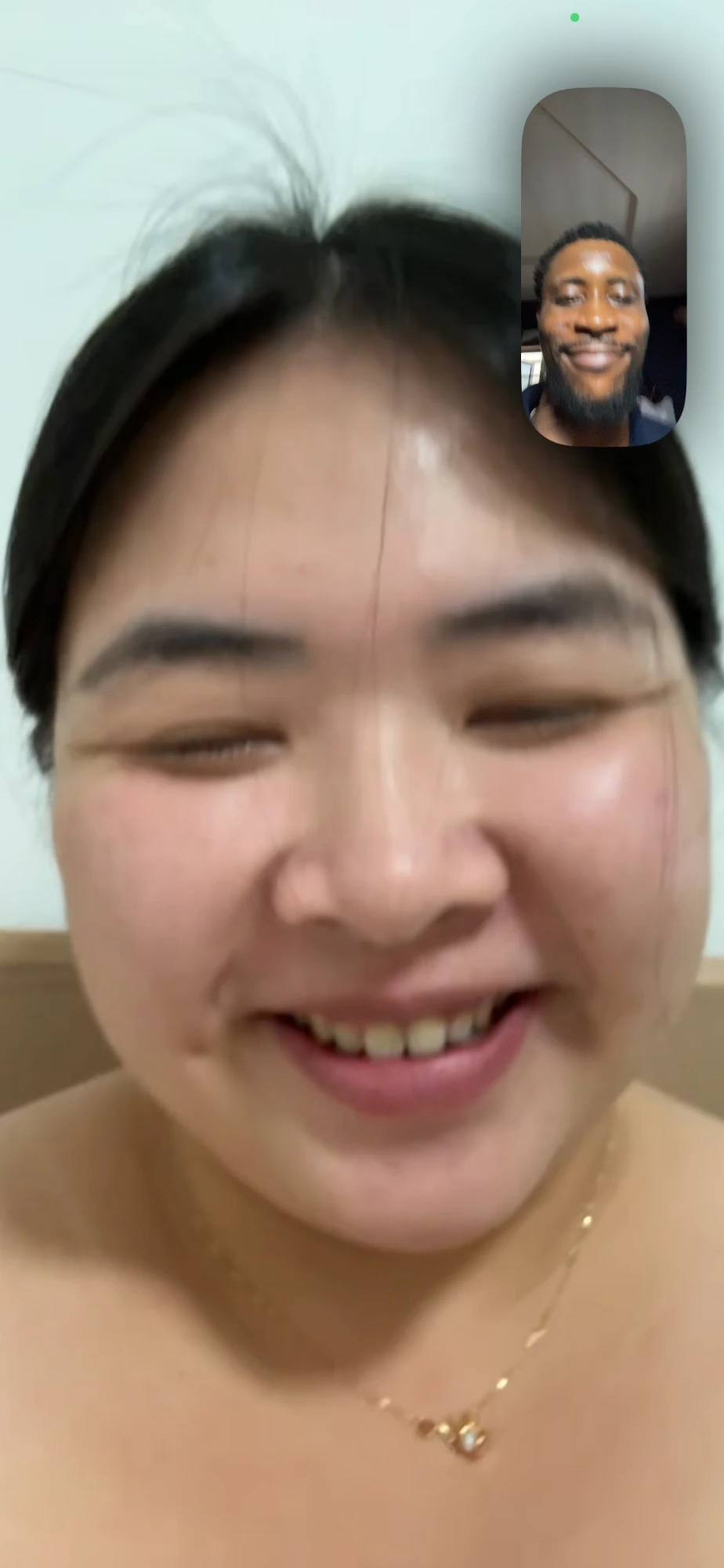 Omalicha laughing on a call